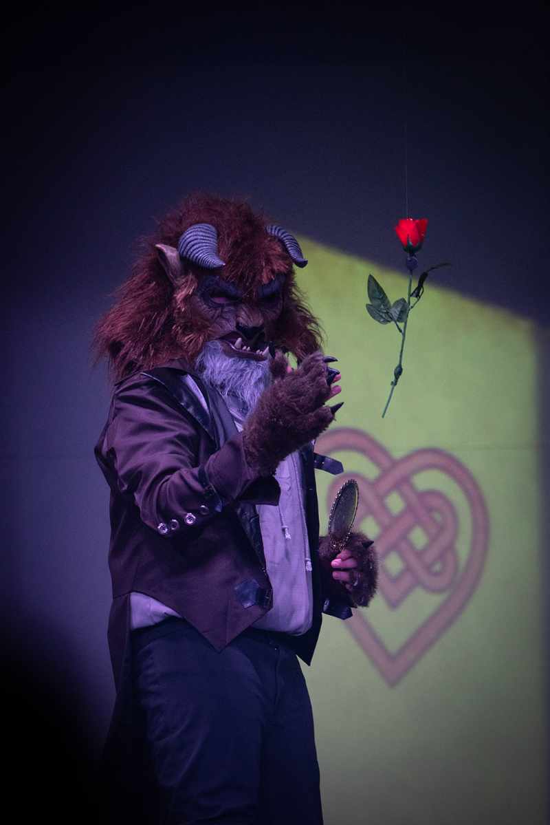 The Beast throwing a rose